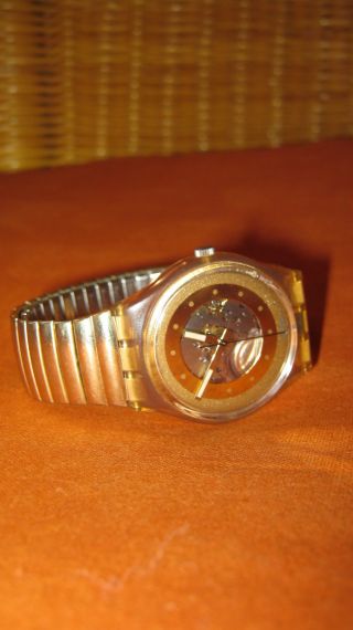 Swatch Sammler Armbanduhr Gold Batterie Bild