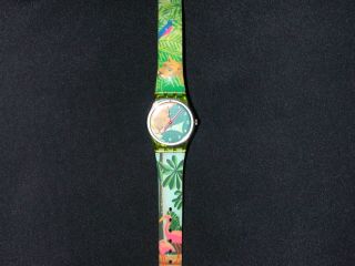 Swatch - Uhr,  Klein (durchmesser: 2,  5 Cm),  Dschungel Mit Löwe Und Flamingos Bild