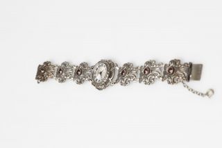 Schöne Trachtenuhr Damenuhr Handaufzug Römische Ziffern 835er Silber 6 Granate Bild