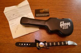 Orginal Gibson Armbanduhr In Gitarren Form: Analog,  Kunstleder,  Quarz : Batterie Bild