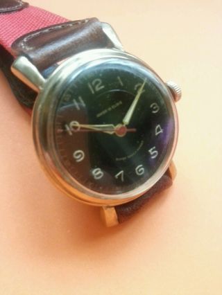 Alte Anker Handaufzug Uhr / Schwarzes Zifferblatt Bild