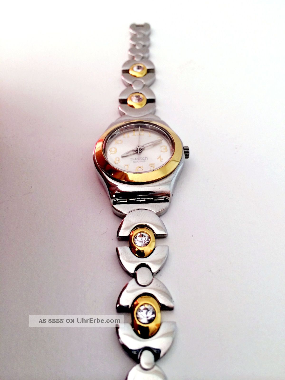 Swatch Damenuhr - Irony Yss In Silber Mit Goldenen Elementen / Lady Armbanduhren Bild