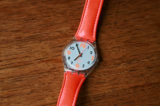 Swatch Designuhr Mit Orange - Neon - Farbenen Armband Bild