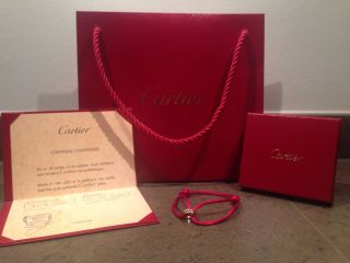 Cartier Armband,  Trinity - Armband,  Markenschmuck,  Ringe Auf Stoffarmband Bild