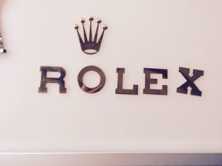 Rolex Schriftzug Bild