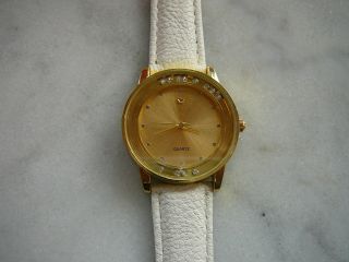 Uhr Armbanduhr Gold Weiß Mit Beweglichen Glitzer Steinen Bader Modeuhr Bild