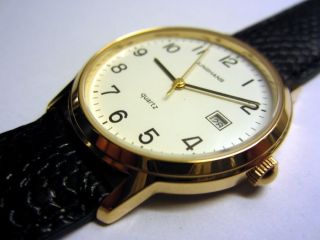 Junghans Quarz Armbanduhr,  Goldfarben,  Quartzuhr,  Ungetragen,  Ovp,  Am Lederband Bild