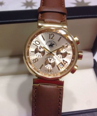 Elegante Herrenuhr / Armband Uhr Edelstahlgehäuse Goldfarbenes Ziffernblatt Bild