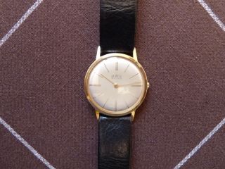 Bwc Swiss / Flache Armbanduhr / Mechanik / Handaufzug / 20 Micron Gold / Um 1960 Bild