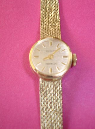 Goldene Damen - Armbanduhr,  Uhrwerk & Armband 14 Karat,  585 Gold,  Manuell,  Fricona Bild