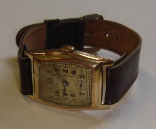 Antike Herrenuhr Record,  Art - Déco 1930/40er Jahre,  Goldfarbenes Uhrwerk Bild