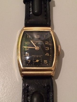 Dugena Armbanduhr / Handaufzug / Kal.  42 Parat / Herrenuhr / Gold - Schwarz Bild