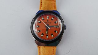 Seltene Junghans Armbanduhr,  Orangefarben,  17 Jewels,  Handaufzug Bild