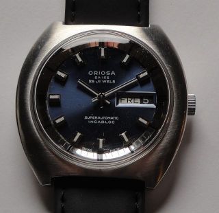 Vintage Armbanduhr Oriosa Superautomatic – Day Date - Mit Blauem Zifferblatt Bild