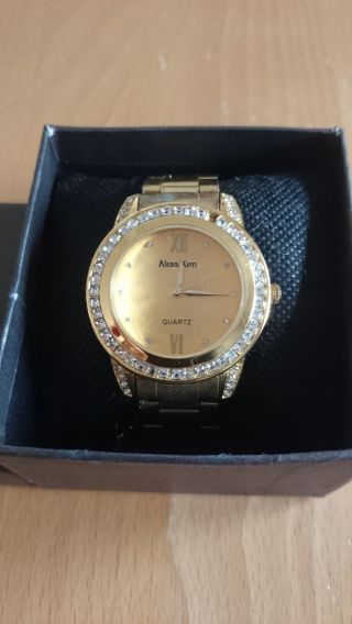 Goldene Damenarmbanduhr Armbanduhr Bild