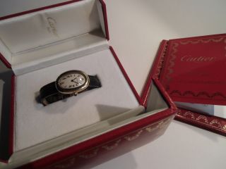 Goldene Damen - Armbanduhr,  Cartier Baignoire Bild